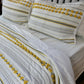 Minimal Ivory Comfy Quilt and Shams with Mustard Poms