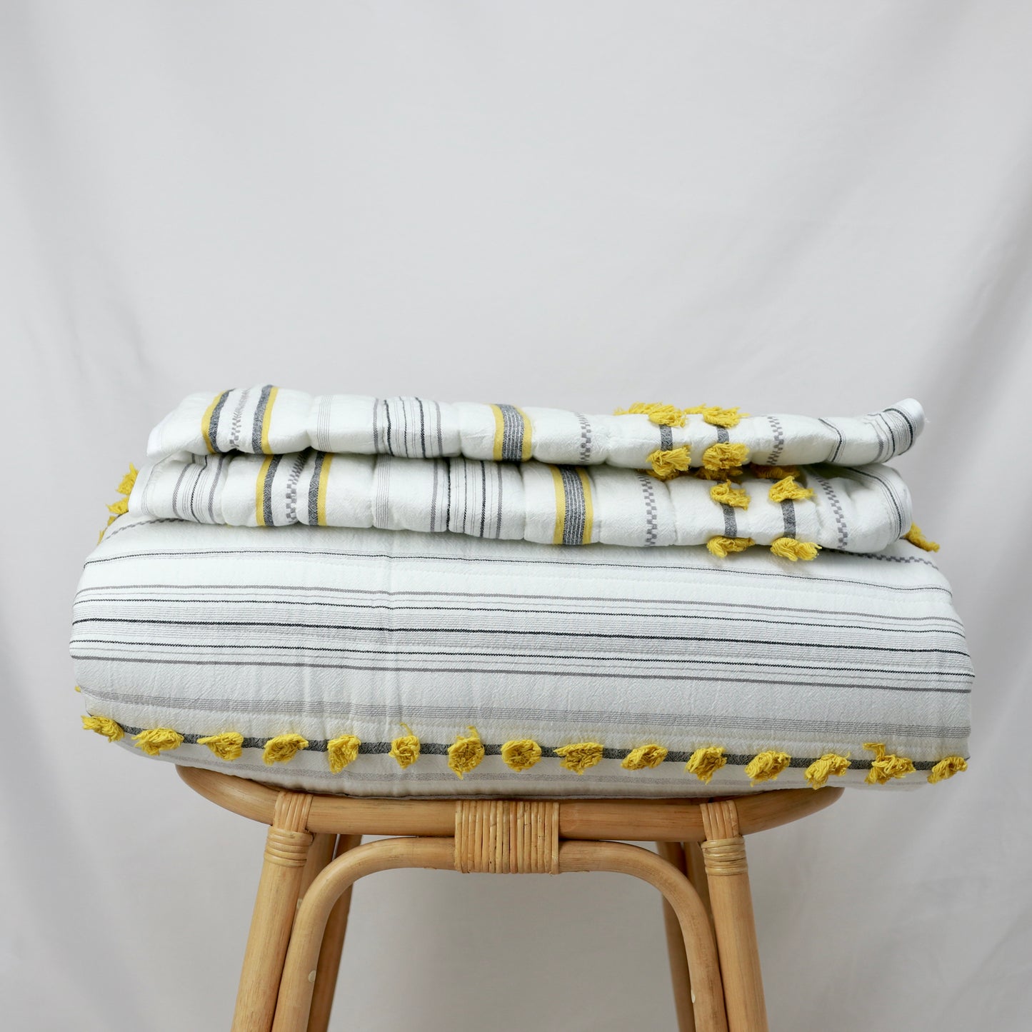 Minimal Ivory Comfy Quilt and Shams with Mustard Poms